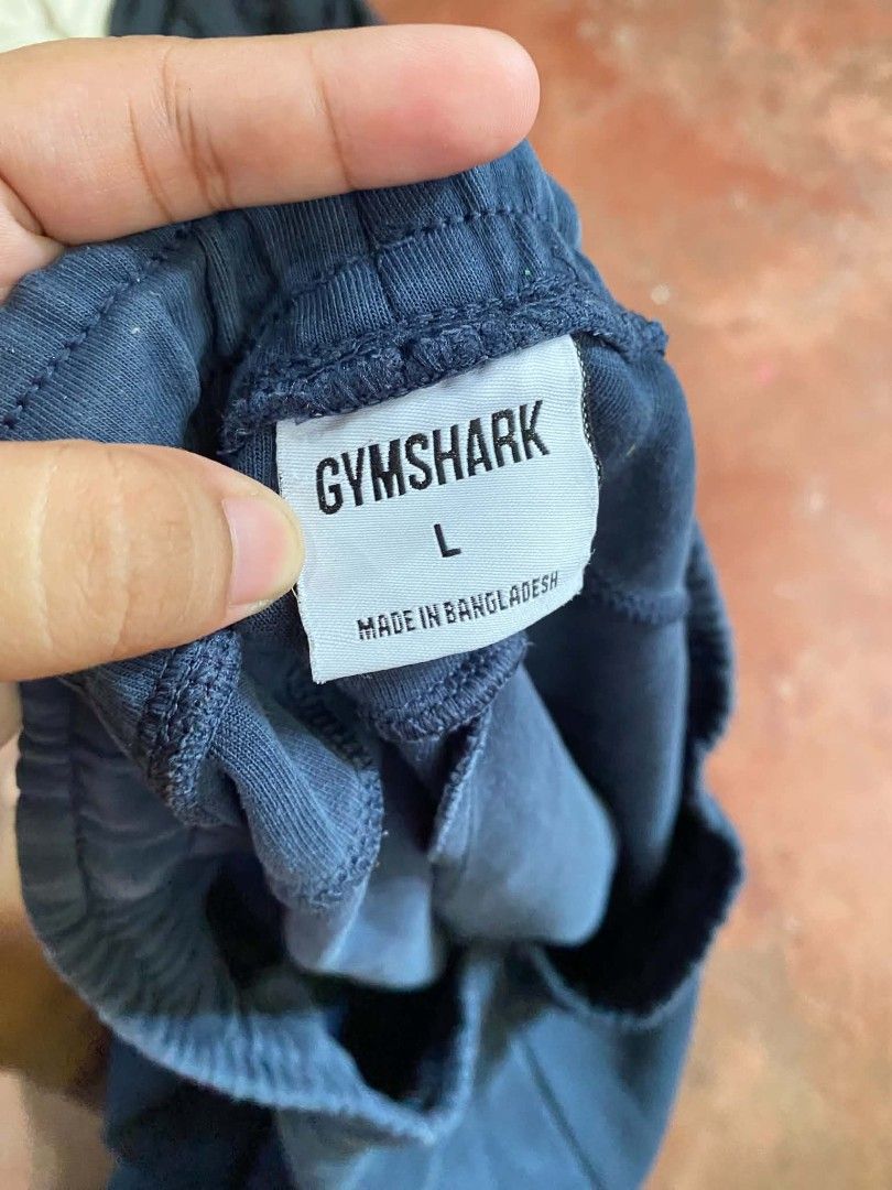 Gymshark Blue Joggers Size L (Category: Joggers) located in Gumaca. Submitted by makuliti (Listing ID 1464793630, Image 3). Description: - Brand/Model: Gymshark Blue Joggers - Size: Large - Material: 80% cotton, 13% recycled polyester, 7% elastane - Features: Adjustable drawstring waistband and secure zippered pockets on both sides - Condition: Good, with slight fabric fraying near one pocket zipper - Perfect for: Gym workouts or everyday casual 