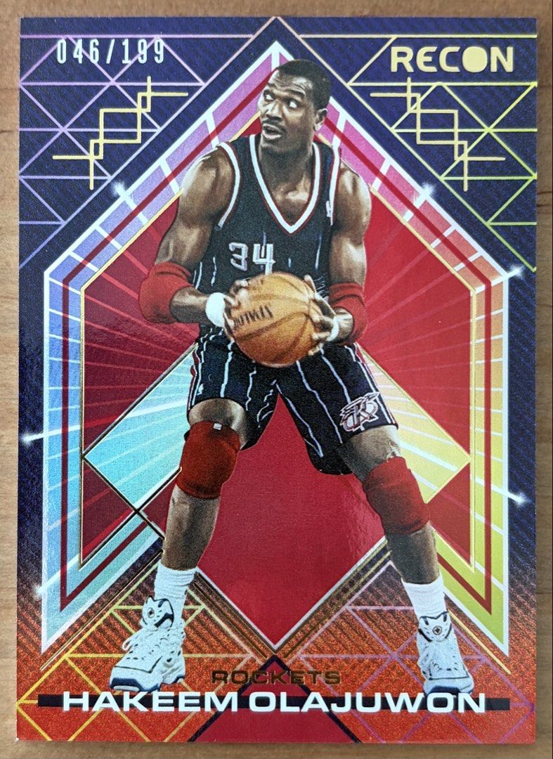 Hakeem Olajuwon | NBA Cards ~ Recon '21 - '22 [Numbered] (Category: Raw Singles) located in Makati City. Submitted by cardlab (Listing ID 1464783376, Image 1). Description: Items are 💯 authentic/original/legit. About The Card: • '21 - '22 Recon • Card No. 187 • Numbered: 046/199 FOR: • Cards ₱99 and below with Card Sleeves • Cards ₱100 and up with Used Toploader • ₱10 for Bnew Tops Packaging (If Shipping): ✔️ Plastic cover ✔️ Cardboard ✔️ Bubble