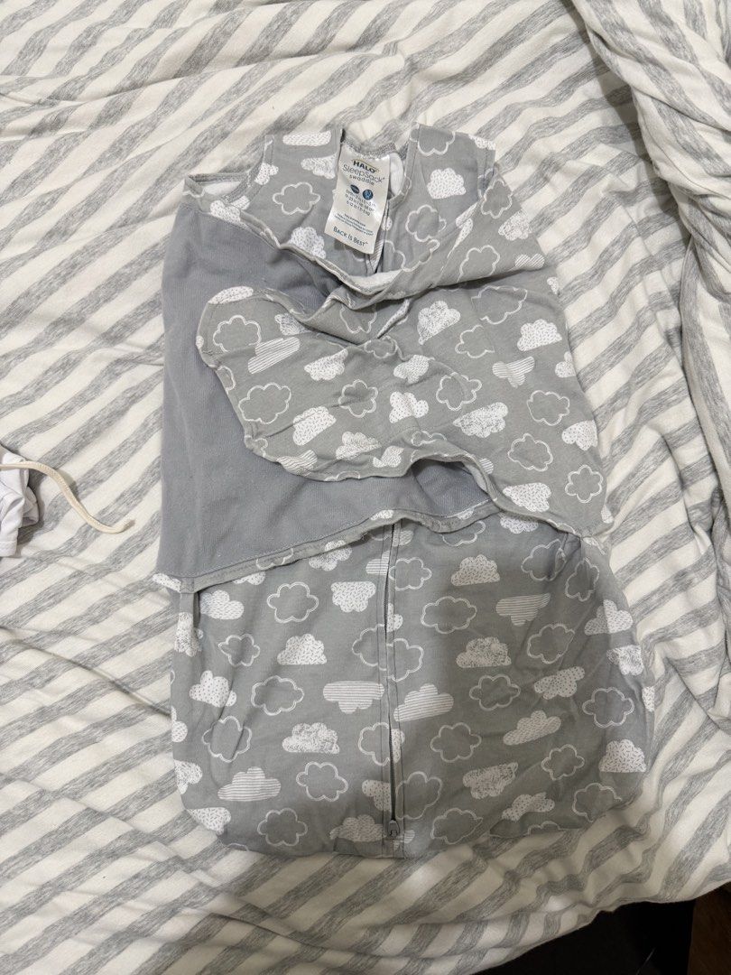 HALO SleepSack Swaddle Grey Cloud Print Newborn (Category: Babies & Kids Fashion) located in Quezon City. Submitted by nicole2314 (Listing ID 1464778922, Image 3). Description: - Brand: HALO SleepSack Swaddle - Design: Cute white clouds on grey background - Size: NB / 0-3 Months - Material: 100% soft, breathable cotton - Features: Adjustable wrap wings for arms-in or arms-out sleeping, and an inverted zipper for hassle-free diaper changes - Condi