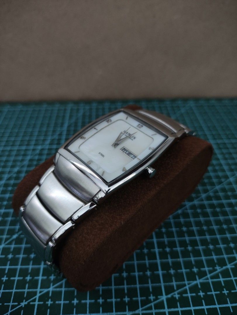 HAMLIN Ultra Thin Tank Watch Day Date Display (Category: Men's Watches) located in Mangatarem. Submitted by kacchon (Listing ID 1460184459, Image 3). Description: - Hamlin ultra-thin watch - Silver tone strap - Mother of Pearl Dial with day and date display at 3 o'clock - Classic rectangular case - American Watch - Integrated Bracelet with Complete Links - Negotiable Price.