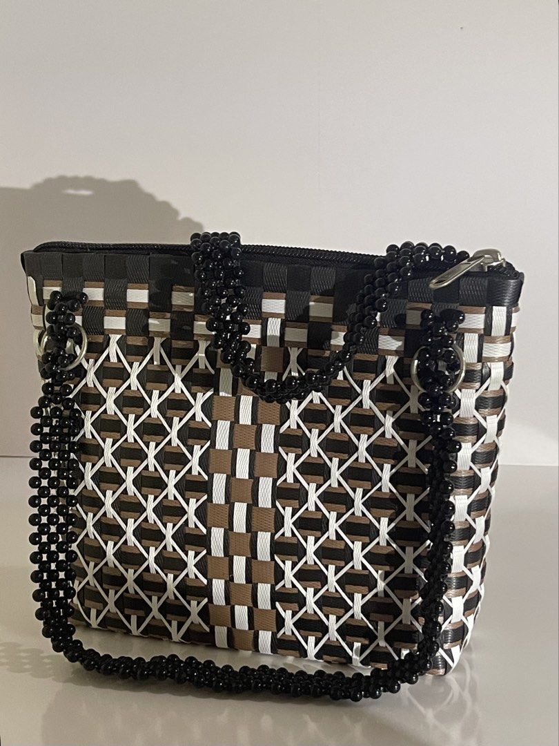 Handmade bags (Category: Shoulder Bags) located in Muntinlupa City. Submitted by declutter.clubph (Listing ID 1464925152, Image 2). Description: “body material: durable recycled plastic closure: Top zipper handles: multi-strand hand beaded shoulder strap with metal ring attachments details: glossy black beadwork. geometric pattern with contrasting lattice accents style: Artisanal. Geometric craftmanship: handcrafted. hand-interlaced detailing. ha