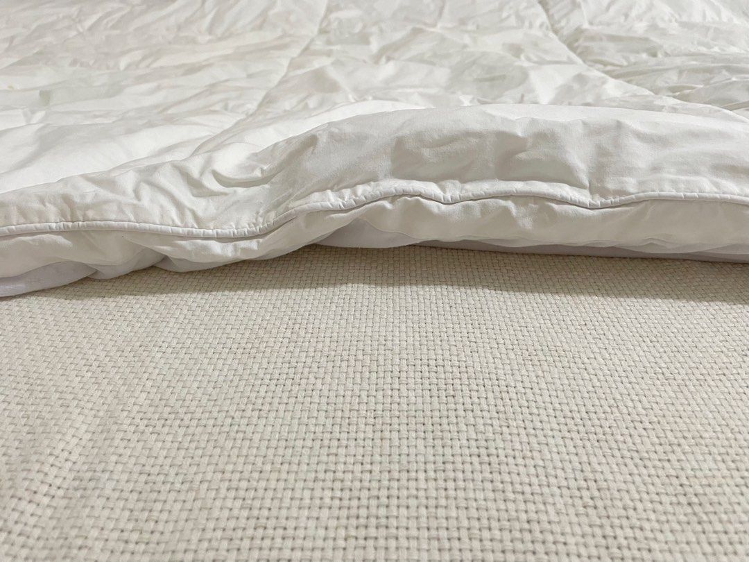 Healthy Home Twin Mattress Protector White (Category: Bedding & Towels) located in Quezon City. Submitted by iamnej (Listing ID 1464946645, Image 3). Description: - Size: Twin (39" x 75"), fits mattresses up to 14" deep - Color: White - Protection: Treated with Sanitized tech against bacteria, mold, and dust mites - Material: Combed cotton japara cover with microfibre polyester filling - Care: Machine washable on gentle cycle ————————————————————