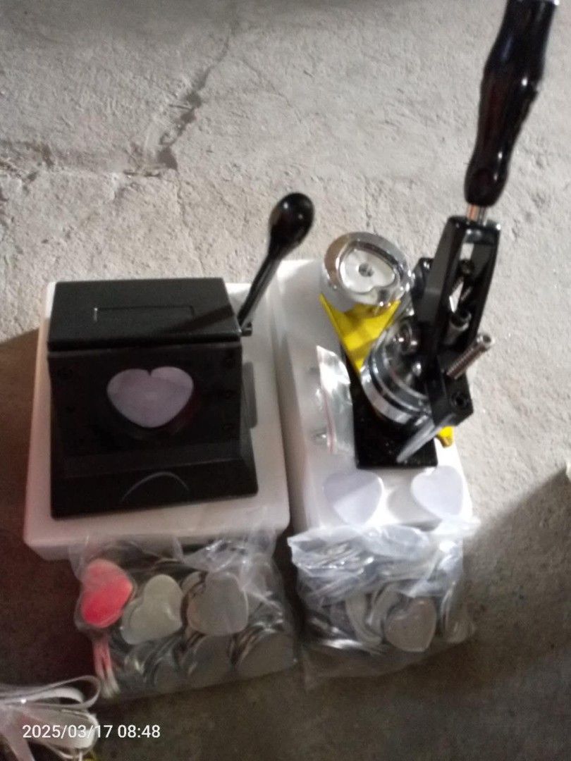 Heart Button Badge Maker Machine with Cutter and Supplies (Category: Craft Supplies & Tools) located in San Mateo. Submitted by emtemplonuevo (Listing ID 1464937325, Image 1). Description: - Complete heart-shaped badge making kit - Includes heavy-duty press machine (black and yellow finish) - Comes with a heart cutter press - Includes lots of metal pin backs with plastic covers (around 100pcs) - Everything needed to start immediately - Great for 