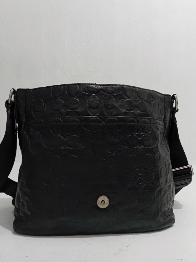 heritage Coach Embossed C leather Messenger bag (Category: Luxury Bags & Wallets) located in Navotas City. Submitted by ms.soulana (Listing ID 1464805424, Image 2). Description: PreOwned lightly Used WellUsed Authentic heritage Coach Embossed C on leather in classic black Messenger bag - Stylish debossed signature C pattern on the front flap - Adjustable nylon shoulder strap with sturdy metal hardware - Secure magnetic snap closure - Clean fabric