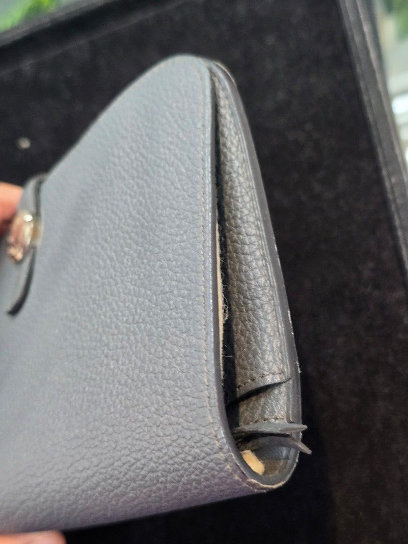 Hermes Dogon Duo Gris Meyer Wallet (Category: Luxury Bags & Wallets) located in Taguig. Submitted by mluxeph (Listing ID 1464796515, Image 3). Description: Hermes Dogon Duo Gris Meyer Wallet Material: Togo calfskin leather Stamp: Square Q Year: 2013 Interior: Five small flat pockets and two main compartments Measurements: 8”L X 0.6”W X 5”H Handle Drop: None Hardware: Palladium Inclusions: Original dust bag and removable zip pouch.