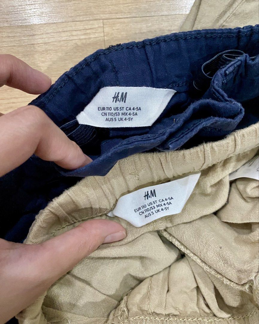 H&M Boys Pants Bundle Size 4-5Y 110 (Category: Babies & Kids Fashion) located in Quezon City. Submitted by buysome.getsome (Listing ID 1464820583, Image 2). Description: - Brand: H&M - Size: EUR 110 / US 5T / UK 4-5Y - Quantity: Set of 2 pairs - Colors & Styles: Dark blue (button and zip fly) and Beige (elastic waistband with white drawstring) - Material: Lightweight and comfortable for daily wear - Condition: Great basic pieces for school or cas
