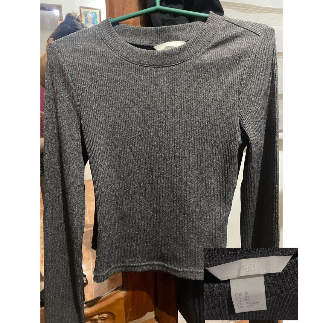 H&M Dark Grey Ribbed Long Sleeve Top (Category: Longsleeves) located in Cabanatuan. Submitted by shans.gem (Listing ID 1464827926, Image 1). Description: - Brand: H&M - Color: Dark Grey - Size: XS (EUR, US, CA, MX) - Material/Texture: Ribbed fabric - Fit: Fitted style - Condition: Excellent, clean with no flaws - Features: Classic crew neckline, great for layering or solo wear.