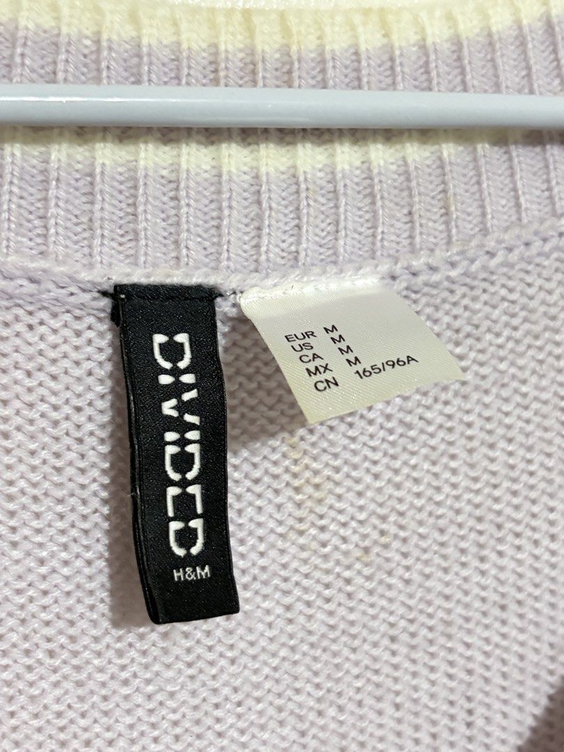 H&M Divided Purple Cable Knit V-Neck Sweater (Category: Longsleeves) located in Cainta. Submitted by knarv__ (Listing ID 1464882083, Image 2). Description: H&M Divided lilac cable knit sweater in size Medium. Features a V-neck collar, relaxed fit, and white striped trim on the collar, cuffs, and hem. Soft and cozy for layering..