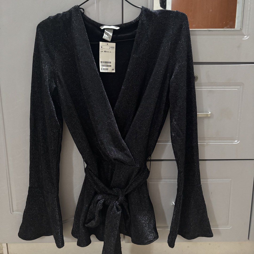 H&M Glittery Wrapover Blouse Peplum Top (Category: Longsleeves) located in Binan City. Submitted by mypreloved_haul (Listing ID 1464814784, Image 1). Description: LAST PRICE POSTED! FOR SURE BUYERS ONLY! FITS UP TO MEDIUM.