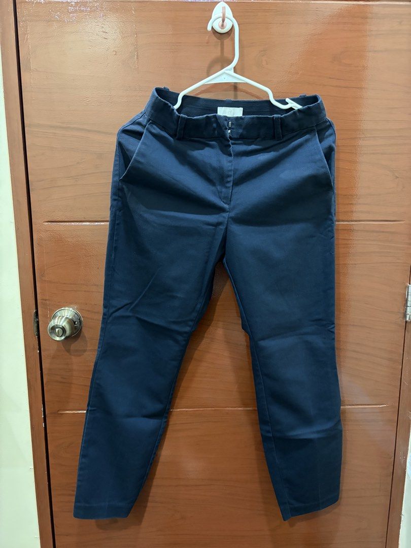 H&M Navy Blue Trousers Size US 6 (Category: Jeans) located in Manila. Submitted by carat.md (Listing ID 1464780813, Image 1). Description: - Brand: H&M - Color: Navy Blue - Size: EUR 38 / US 6 / CA 6 / MX 6 / CN 160/72A - Waist: Elastic at the back with belt loops for comfort and fit - Closure: Standard zip fly and button - Pockets: Functional front pockets - Condition: Clean fabric, solid dark color - Style: Versatile for everyday office or casu