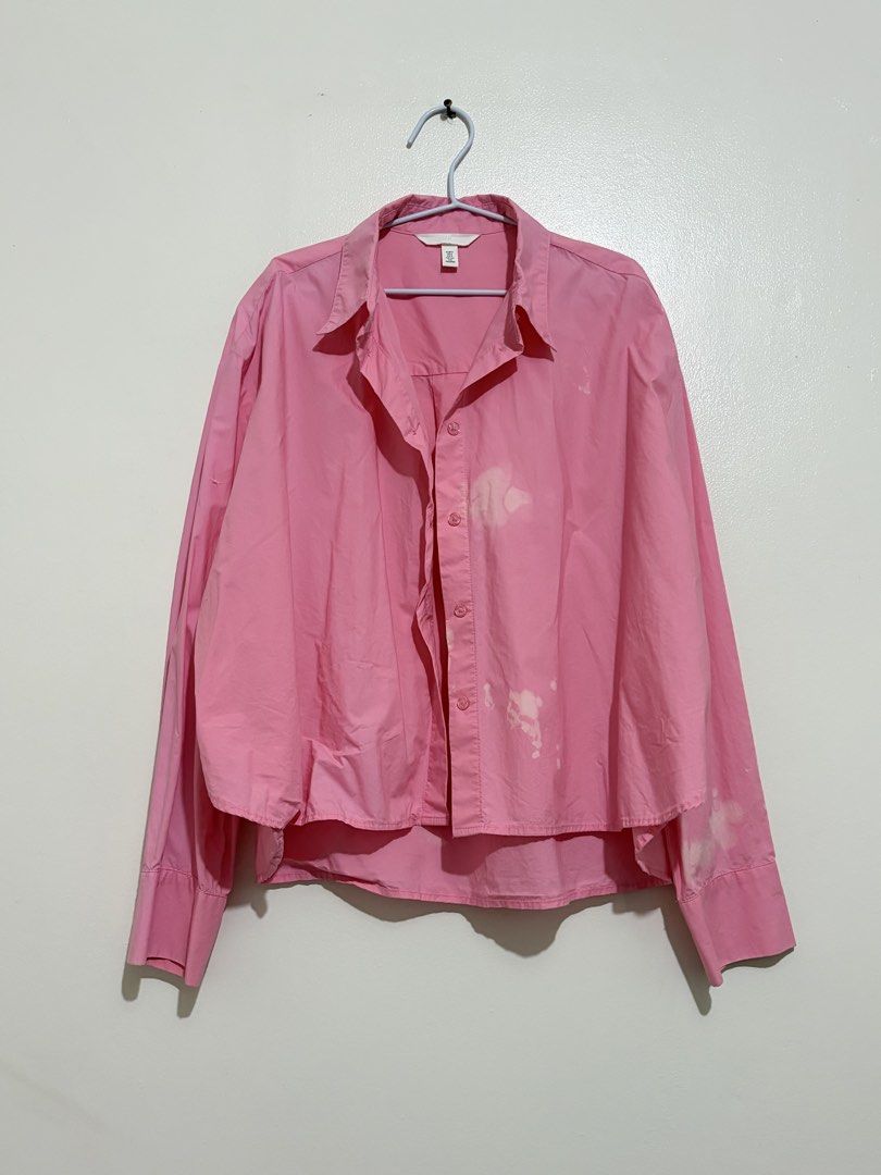 H&M Pink Button-Down Long Sleeve Shirt Size S (Category: Longsleeves) located in Cainta. Submitted by knarv__ (Listing ID 1464881802, Image 1). Description: Bright pink H&M button-down shirt in Size S. Features long sleeves, a classic collar, and a trendy high-low hem. Made of soft cotton. Please note: there are noticeable bleach stains on the chest, lower placket, and right cuff. Great price for a stylish piece!.