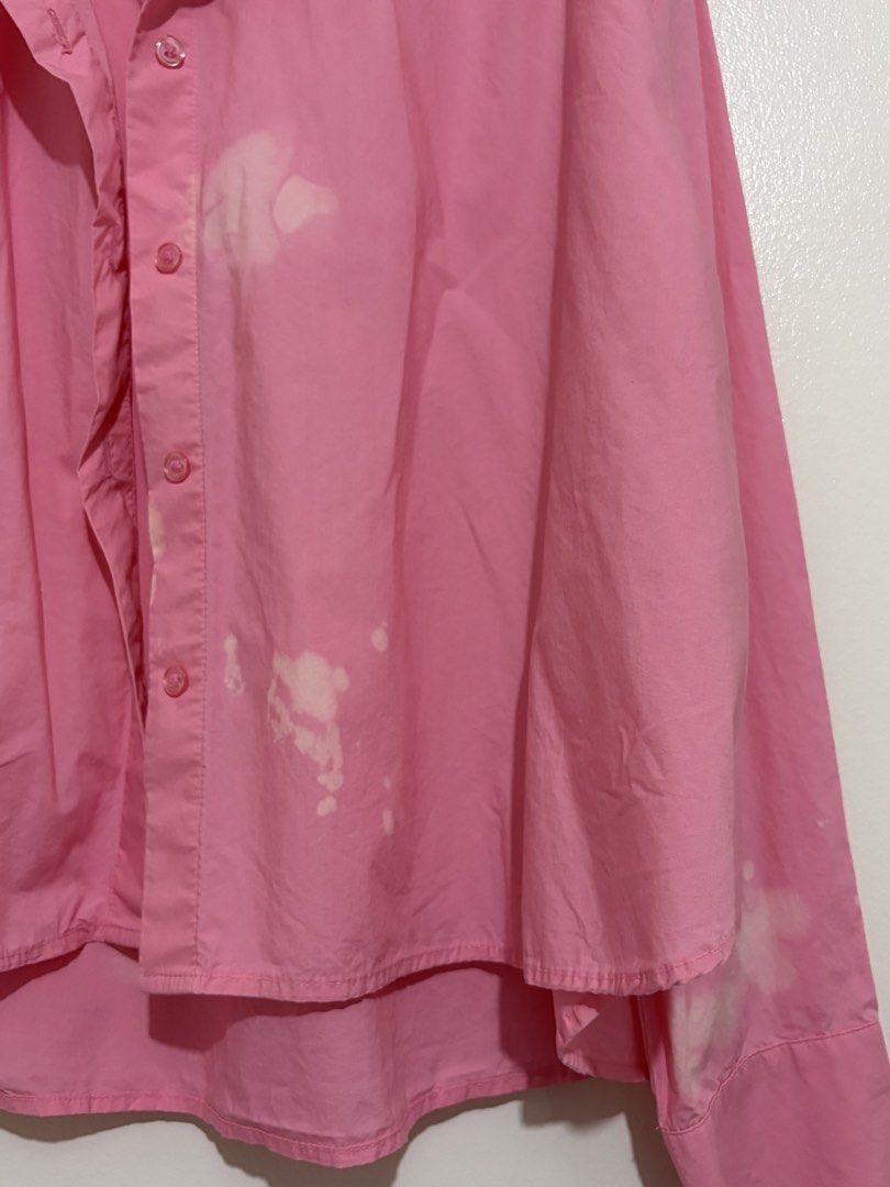 H&M Pink Button-Down Long Sleeve Shirt Size S (Category: Longsleeves) located in Cainta. Submitted by knarv__ (Listing ID 1464881802, Image 2). Description: Bright pink H&M button-down shirt in Size S. Features long sleeves, a classic collar, and a trendy high-low hem. Made of soft cotton. Please note: there are noticeable bleach stains on the chest, lower placket, and right cuff. Great price for a stylish piece!.