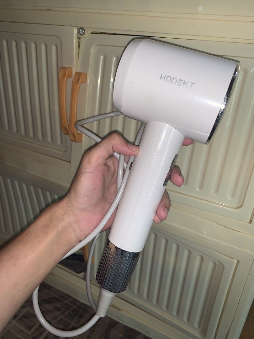 Hodekt Hair Dryer (Category: Hair) located in Manila. Submitted by jessa480 (Listing ID 1464796174, Image 2). Description: - Brand: Hodekt - Color: Clean white with stylish silver chrome accents - Condition: Excellent and fully functional - Features: Compact size, quick hot air drying, and a long white cord with a standard plug - Ideal for: Fast and convenient everyday hair styling USED ONCE FOR PROMOTION AS AN AFFILIATE.