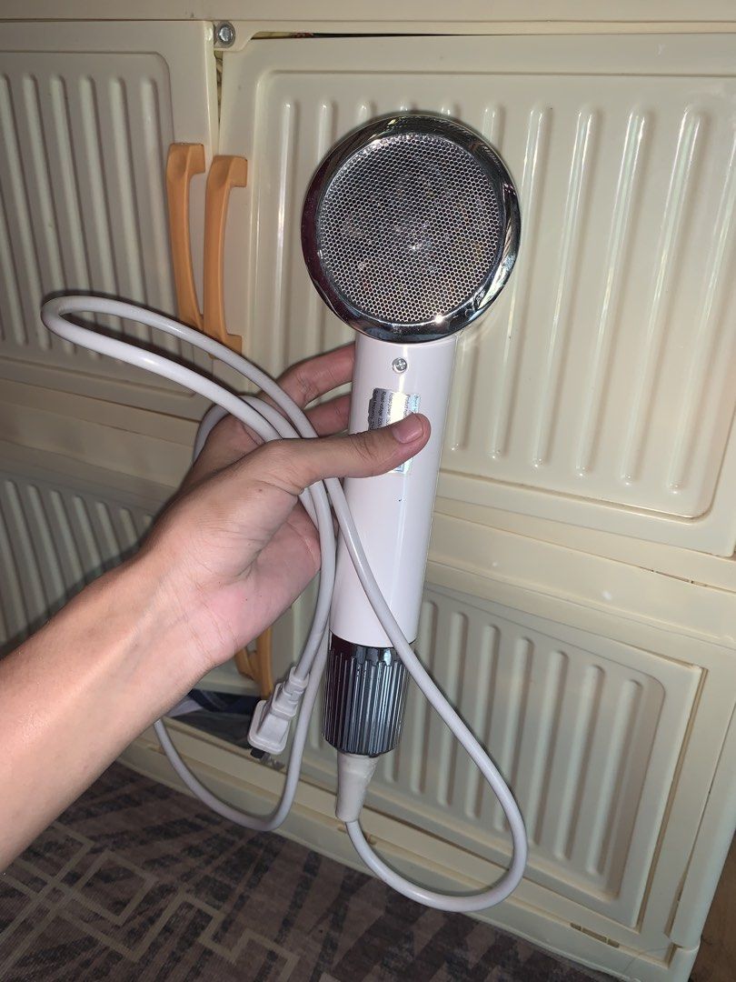 Hodekt Hair Dryer (Category: Hair) located in Manila. Submitted by jessa480 (Listing ID 1464796174, Image 3). Description: - Brand: Hodekt - Color: Clean white with stylish silver chrome accents - Condition: Excellent and fully functional - Features: Compact size, quick hot air drying, and a long white cord with a standard plug - Ideal for: Fast and convenient everyday hair styling USED ONCE FOR PROMOTION AS AN AFFILIATE.