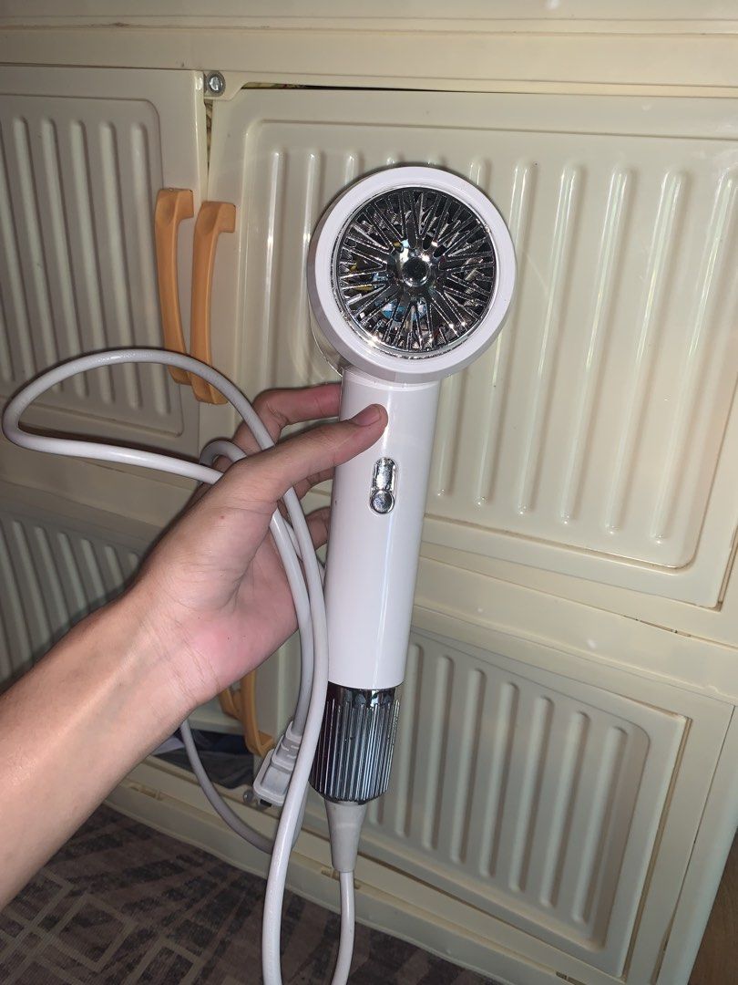 Hodekt Hair Dryer (Category: Hair) located in Manila. Submitted by jessa480 (Listing ID 1464796174, Image 1). Description: - Brand: Hodekt - Color: Clean white with stylish silver chrome accents - Condition: Excellent and fully functional - Features: Compact size, quick hot air drying, and a long white cord with a standard plug - Ideal for: Fast and convenient everyday hair styling USED ONCE FOR PROMOTION AS AN AFFILIATE.