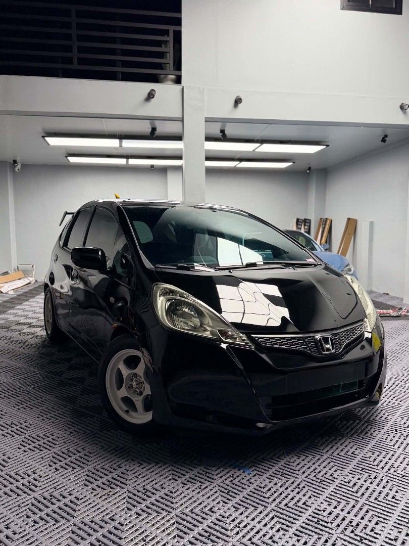 Honda Jazz (M) (Category: Used Cars) located in Dagupan City. Submitted by silvercat_cd7b23 (Listing ID 1464809584, Image 2). Description: Well maintained. Very fuel efficient! For Sale‼️ 2013 Honda Jazz GE 1.3 Manual Transmission SEMI LOADED Details: Newly Ceramic Coating Sept 2026 Newly change oil June 2026 92,xxx odo orig mileage unli scan Complete original papers With manual booklet 1st owner acq., open DOS LTO Registered til 2027 Ice Cold AC