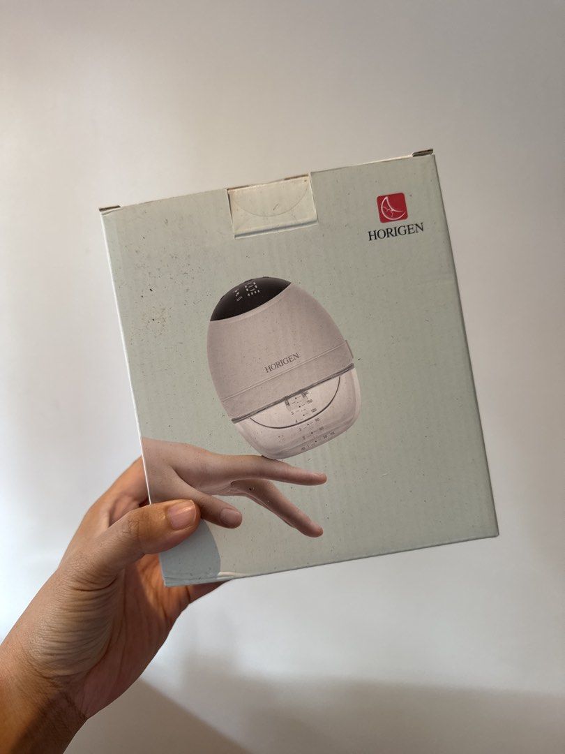 Horigen Wearable Electric Breast Pump (Category: Breastfeeding & Bottle Feeding) located in Quezon City. Submitted by fortunefoundry (Listing ID 1464773211, Image 1). Description: - Horigen wearable electric breast pump - one in original box (minor box wear from storage) - Hands-free design for convenient pumping on the go - Compact motor unit with an integrated collection cup - Clear volume markings on the side for easy output tracking FREE teet