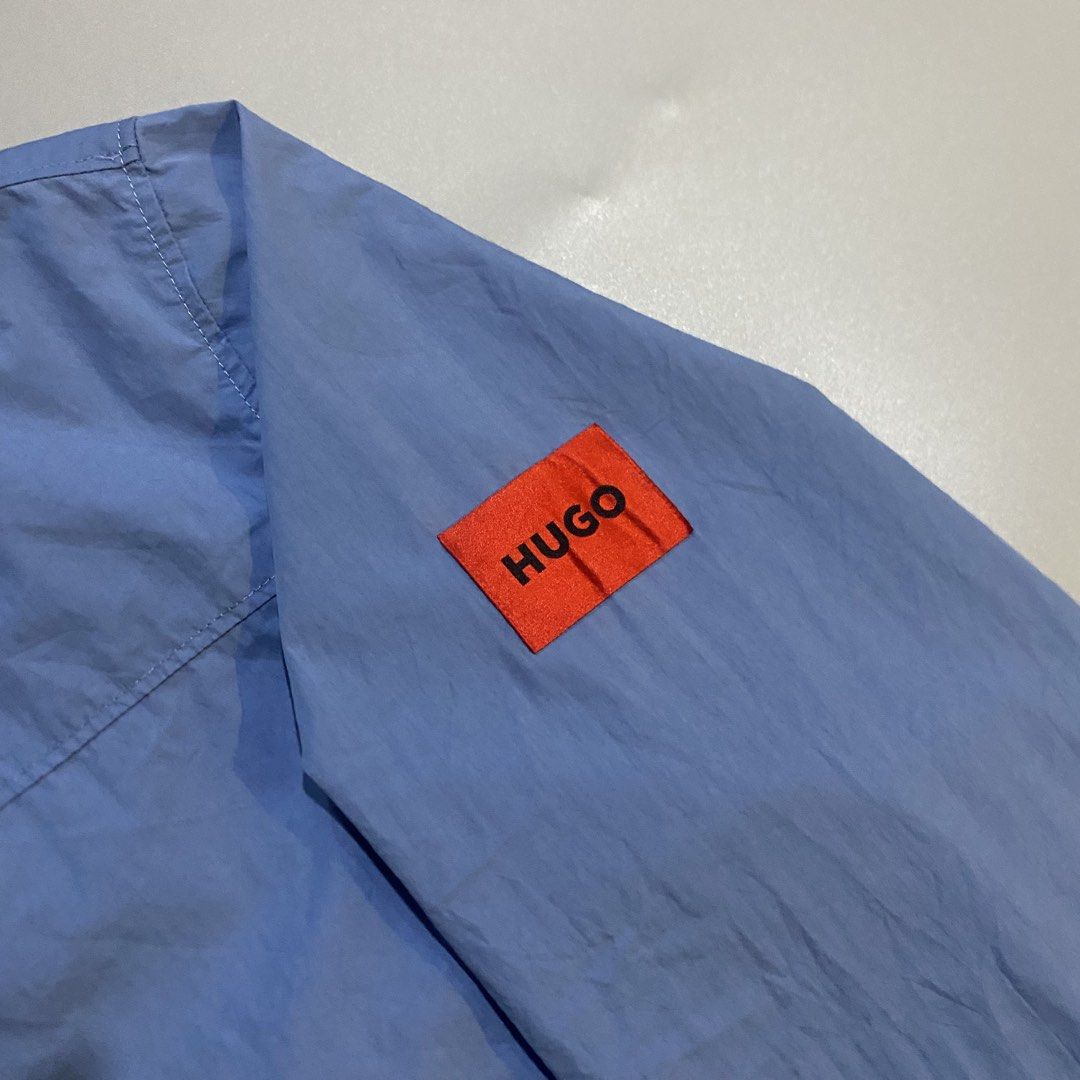Hugo Boss Windbreaker Jacket (Category: Coats, Jackets and Outerwear) located in San Jose del Monte. Submitted by edmarkvillanueva (Listing ID 1464882242, Image 2). Description: Hugo Boss Windbreaker Hoodie Length 28.5” Width 23” Size on tag: Medium Flaws: minimal stain on drawstring only 9.8/10 Color Rate ₱680 plus shipping fee only🛒.