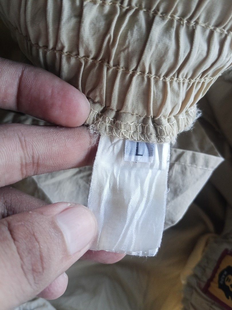 Human Made Beige Shorts Size L (Category: Shorts) located in Lingayen. Submitted by rahzzelula73279 (Listing ID 1464864057, Image 3). Description: - Brand: Human Made - Size: L - Color: Beige - Details: Elastic waistband with drawstring, embroidered polar bear patch with red lettering - Origin: Made in Japan - Condition: Clean fabric, brand and wash tags attached - Style: Casual wear.