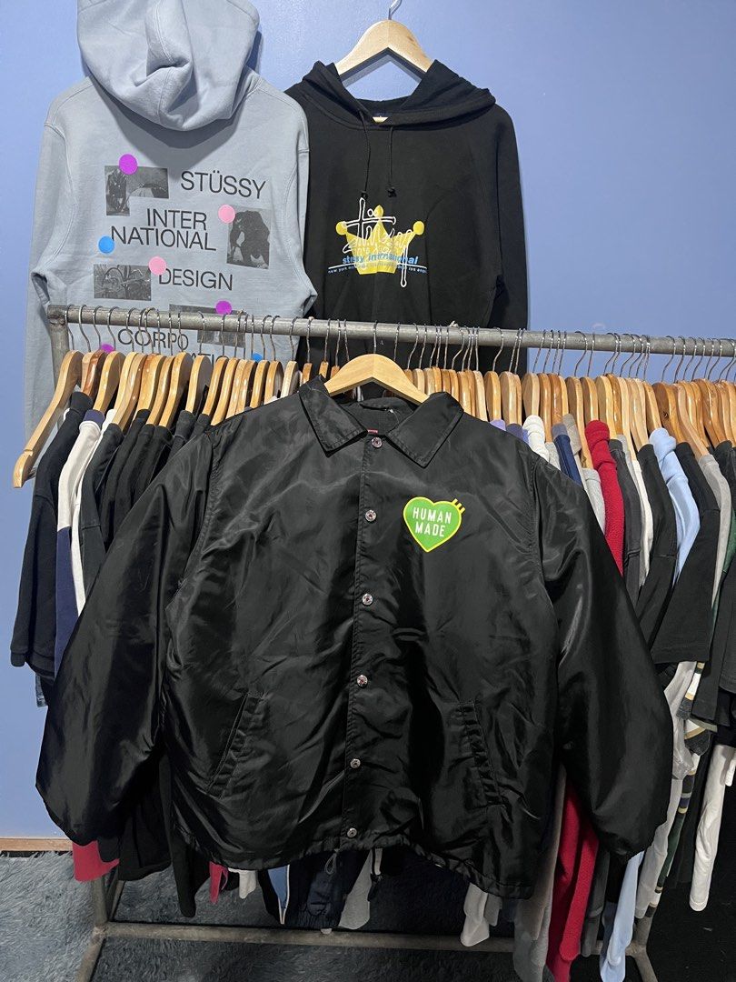 Human Made Black Coach Jacket Size L (Category: Coats, Jackets and Outerwear) located in Davao. Submitted by erwin_james (Listing ID 1464889077, Image 1). Description: - Brand: Human Made (by Nigo) - Style: Black coach jacket with collared neckline and snap button closure - Size: Large - Design: Large green heart graphic with white branding on the back, matching green heart on the left chest - Details: Features inner lining and authentic tag bran