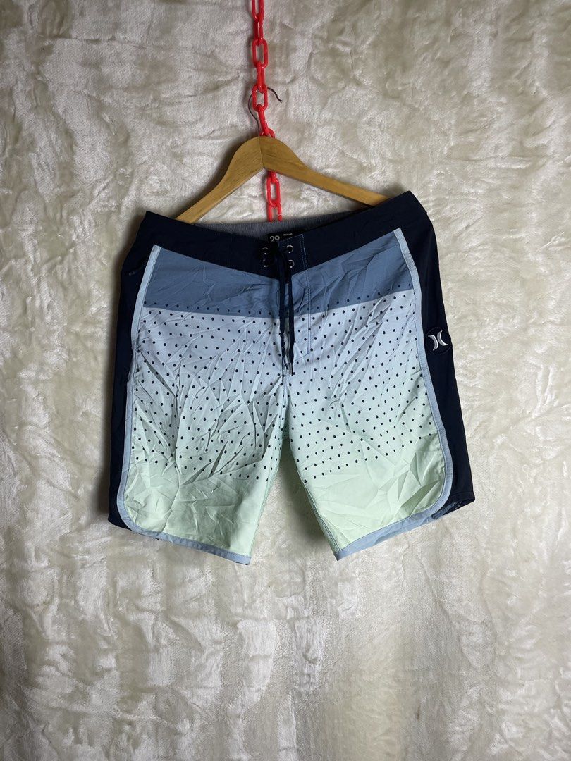 Hurley Phantom Board Shorts Size 29 Blue Polka Dot (Category: Swim Trunks & Board Shorts) located in Molave. Submitted by charlesthrifter (Listing ID 1464896510, Image 1). Description: - Brand: Hurley Phantom - Size: 29 - Color/Design: Blue and mint green with a polka dot lower section and solid black sides - Features: Drawstring closure with branded eyelets and a convenient side zip pocket - Material: Lightweight stretch fabric ideal for surfing