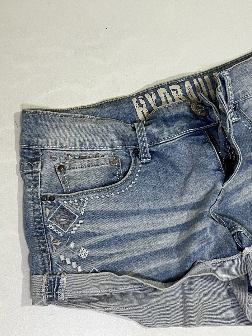 Hydraulic Bailey Denim Shorts Size 5/6 (Category: Shorts) located in Manila. Submitted by sennisen (Listing ID 1464924930, Image 2). Description: - Brand: Hydraulic Bailey - Wash: Light blue - Fit: Mid-rise with a bit of stretch (98% cotton, 2% spandex) - Details: Diamond embroidery and rhinestone hardware on front pockets - Hem: Cuffed raw hem - Closure: Zip fly with button.