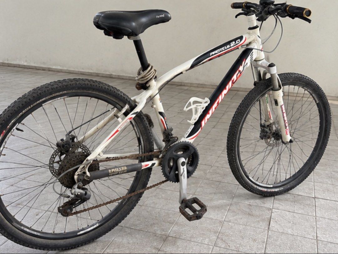 Infinity Proteus 2.0 Mountain Bike (Category: Bicycles) located in Muntinlupa City. Submitted by shopnb (Listing ID 1464780268, Image 3). Description: Selling a Infinity Proteus 2.0 MTB — a solid older-generation mountain bike with a lightweight alloy frame and good components. Features: * Infinity Proteus 2.0 frame * Shimano drivetrain/components * Front suspension fork * Front & rear disc brakes * Knobby MTB tires * Alloy wheels * Wide MTB hand