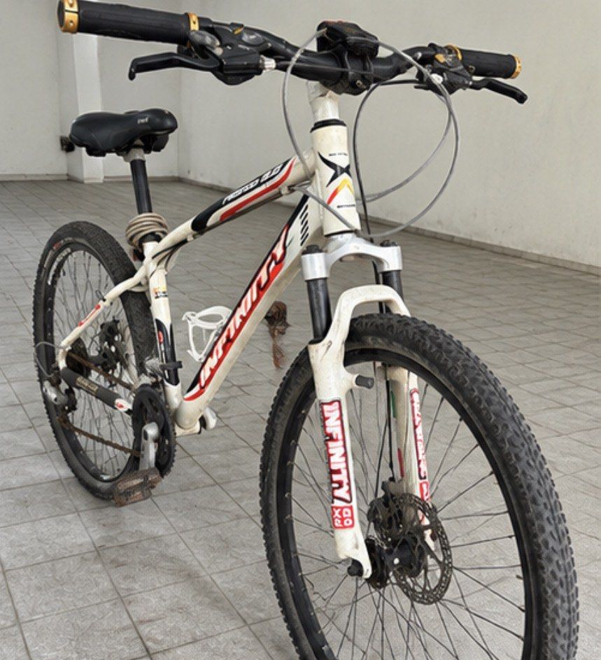 Infinity Proteus 2.0 Mountain Bike (Category: Bicycles) located in Muntinlupa City. Submitted by shopnb (Listing ID 1464780268, Image 2). Description: Selling a Infinity Proteus 2.0 MTB — a solid older-generation mountain bike with a lightweight alloy frame and good components. Features: * Infinity Proteus 2.0 frame * Shimano drivetrain/components * Front suspension fork * Front & rear disc brakes * Knobby MTB tires * Alloy wheels * Wide MTB hand