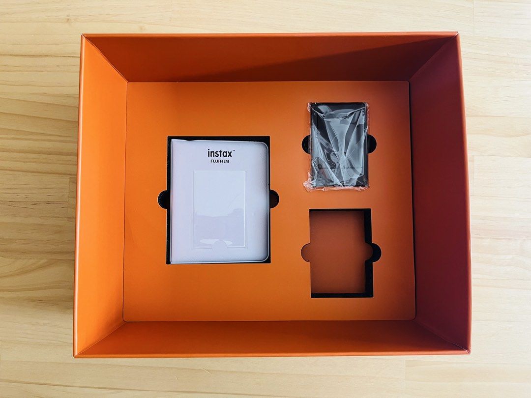 Instax Mini Evo Leather Kit (Brown) (Category: Cameras) located in Manila. Submitted by nucellenagar (Listing ID 1464771490, Image 3). Description: Instax Mini Evo Leather Kit (Brown) - Good as new - No issues and fully functional - Original price: P14,999 Inclusions: • Instax Mini Evo Brown • SD Card (32GB) • Leather case • Photo album • Photo frames Note: No films included. Location: Sikatuna Village, Diliman, QC.