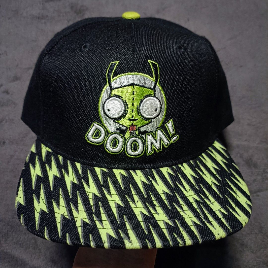 Invader Zim Gir Doom Snapback Hat Nickelodeon (Category: Caps & Hats) located in Manila. Submitted by nye.seller (Listing ID 1464886629, Image 1). Description: - Official Nickelodeon Invader Zim merchandise (2024) - Features embroidered Gir graphic with "DOOM!" on the front - All-over bright green lightning bolt print on the flat brim - Neon green adjustable plastic snap closure and matching top button - Invader Zim logo embroidered above the bac