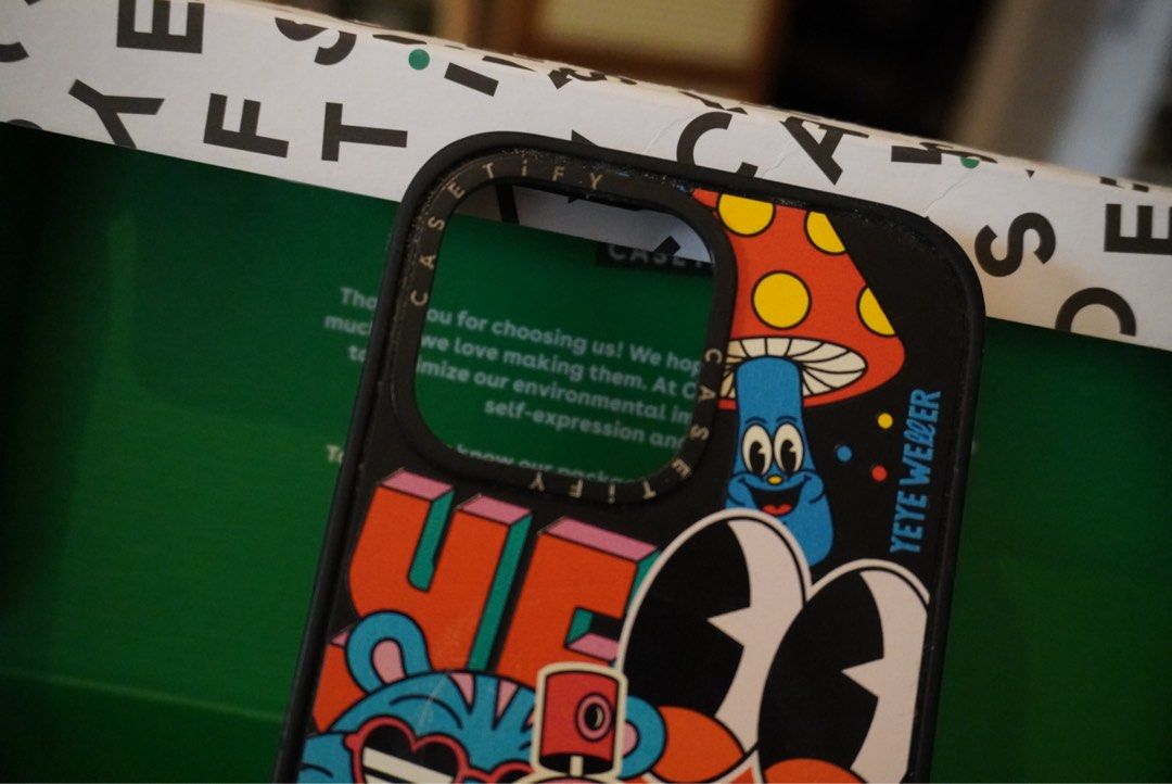 Iphone 12pro max Casetify (Category: Cases & Sleeves) located in Manila. Submitted by skywalker14 (Listing ID 1464814549, Image 1). Description: - Brand/Model: Casetify case for iPhone 12 Pro Max - Design: Vibrant Yeye Weller cartoon sticker bomb artwork - Features: MagSafe compatible (integrated white ring on the inner lining), sturdy black bumper frame - Condition: Well-maintained and ready to use (just needs cleaning) - Compatibility: Fits iPh