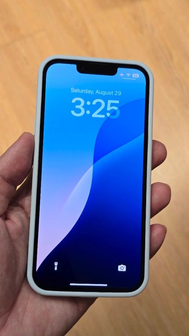 Iphone 14/128GB (Category: iPhone 14 Series) located in Quezon City. Submitted by emem_00 (Listing ID 1464950572, Image 3). Description: - Model: iPhone 14 - Storage: 128GB - Color: Blue - Condition: Pre-loved, well-maintained with case.