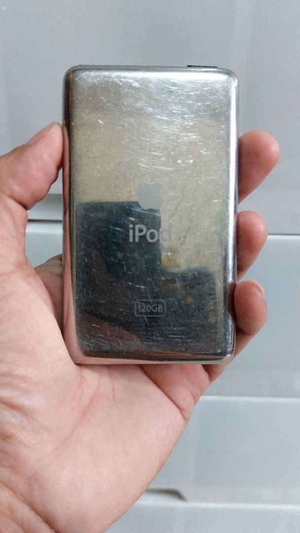 iPod Classic 6th Gen. 120GB Black (Category: Portable Music Players) located in Quezon City. Submitted by christopher.torio18 (Listing ID 1464874341, Image 2). Description: iPod Classic 6th Generation Storage Capacity: 120GB Black front, polished metal back Fully working, powers on, and displays menus and storage info correctly Controls: Click wheel is 100% operational Flaws: Heavy scratching on the metal backplate from normal pocket use Same ime