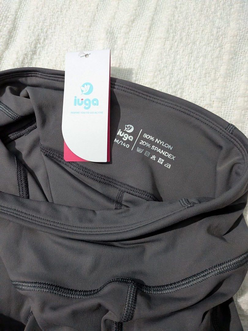 Iuga Athletic Shorts with Pockets Dark Grey Size M (Category: Activewear) located in Iba. Submitted by leovincee.1414 (Listing ID 1464816104, Image 2). Description: - Brand: Iuga Athletic Shorts - Color: Dark Grey - Size: Medium (M) - Condition: Brand new with original store tag attached - Material: 80% Nylon, 20% Spandex (soft & stretchy) - Features: High waist design, functional side pockets, and a back waistband pocket - Best for: Gym workouts