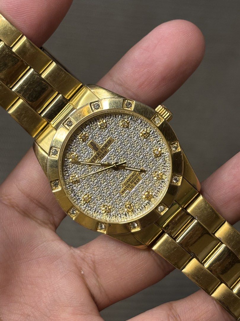 Jacques Poirier Paris Iced-Out (Category: Men's Watches) located in Manila. Submitted by soughtafterseconds (Listing ID 1464814581, Image 2). Description: Jacques Poirier Paris Iced-Out This Jacques Poirier Paris Iced-Out Diamond Accent Gold Quartz Watch (Ref. JS4001) is a bold, high-shine piece of late-1990s to early-2000s French fashion horology, combining a diamond-paved aesthetic with an integrated sports-luxury silhouette. The watch features