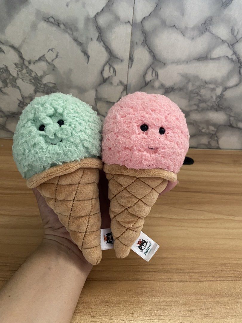 Jellycat Irresistible Ice Cream Mint & Strawberry (Category: Plushies & Soft Toys) located in Caloocan City. Submitted by izzyjelly (Listing ID 1464868430, Image 1). Description: FREE Shipping Two Jellycat ice cream plushies, mint green and pink flavours. Soft fuzzy scoop with stitched smiles and safety eyes. Waffle cone body with quilted texture. Original Jellycat London tags attached. Selling together as a set. Clean, fluffy, smoke free home..