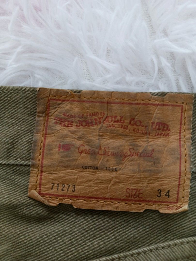 Johnbull Co. Ltd. Olive Green Cotton Pants Size 34 (Category: Trousers) located in Jolo. Submitted by zah-zah (Listing ID 1464790421, Image 3). Description: - Brand/Origin: Johnbull Co. Ltd. from Kojima, Japan - Material: 100% cotton heavy twill in an earthy olive green - Size: Tagged Size 34 - Features: Button fly closure, front and back pockets, stylish leather back patch - Condition/Style: Solid staple piece, perfect for everyday casual wear.