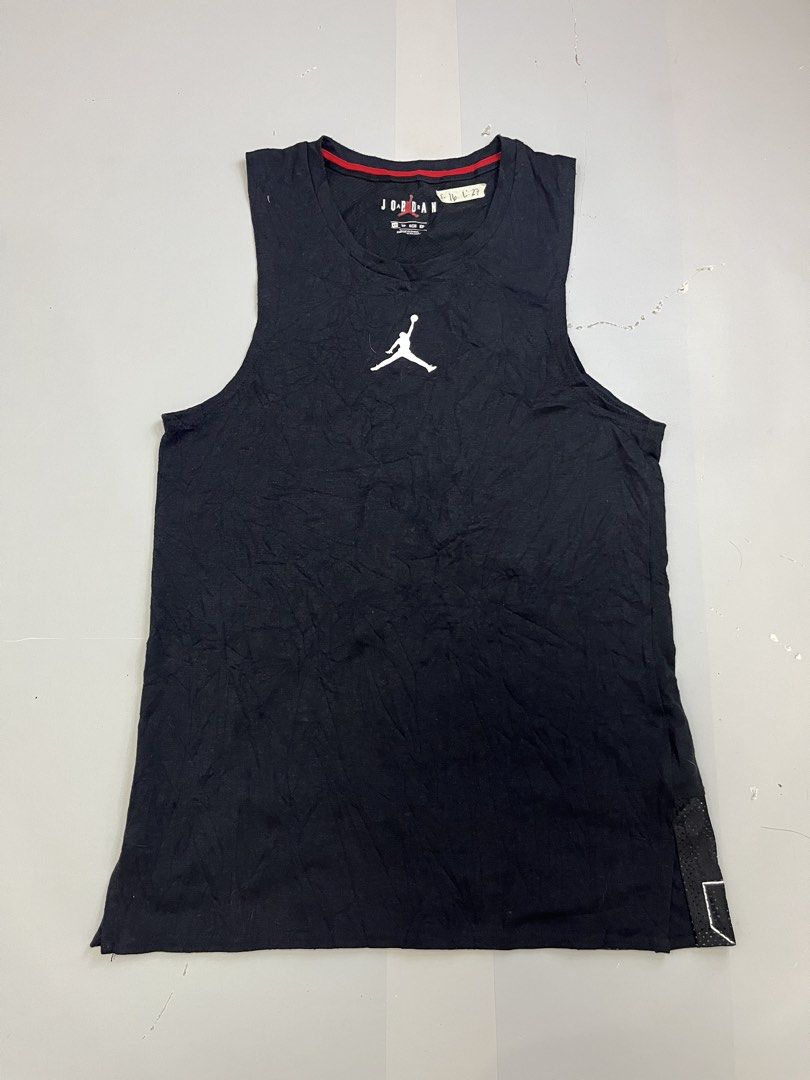 Jordan Black Jumpman Tank Top (Category: Activewear) located in Mabalacat. Submitted by aas_thriftfings (Listing ID 1464785273, Image 1). Description: - Brand: Jordan - Style: Sleeveless Tank Top - Size: XS - Style Code: CJ5545-010 - Color: Black with white Jumpman logo and red collar piping - Features: Back mesh hem with large stitched white JORDAN lettering - Material: Sustainable blend of recycled polyester, organic cotton, and rayon - Conditi