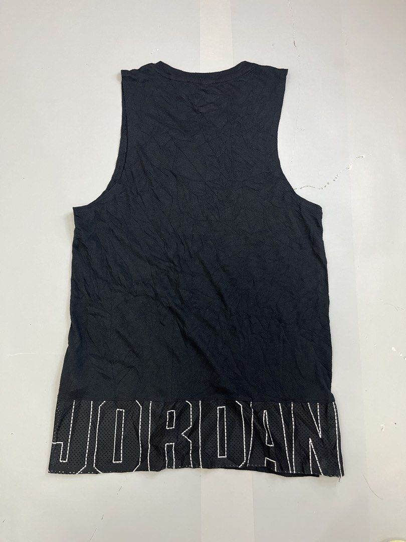 Jordan Black Jumpman Tank Top (Category: Activewear) located in Mabalacat. Submitted by aas_thriftfings (Listing ID 1464785273, Image 2). Description: - Brand: Jordan - Style: Sleeveless Tank Top - Size: XS - Style Code: CJ5545-010 - Color: Black with white Jumpman logo and red collar piping - Features: Back mesh hem with large stitched white JORDAN lettering - Material: Sustainable blend of recycled polyester, organic cotton, and rayon - Conditi