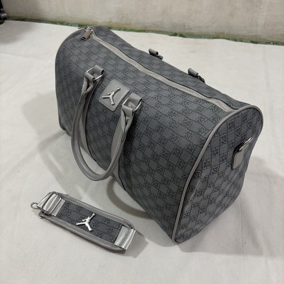 Jordan Monogram Pattern Duffel Bag Grey Y2k (Category: Luxury Bags & Wallets) located in Cavite. Submitted by itsayaaa (Listing ID 1464837962, Image 1). Description: - Jordan duffel bag in a stylish grey monogram pattern - Silver-tone hardware with iconic Jumpman logo on the front and strap - Secure top zip closure with sturdy dual carrying handles - Includes an adjustable and detachable shoulder strap for versatile wear - Spacious dark-lined int