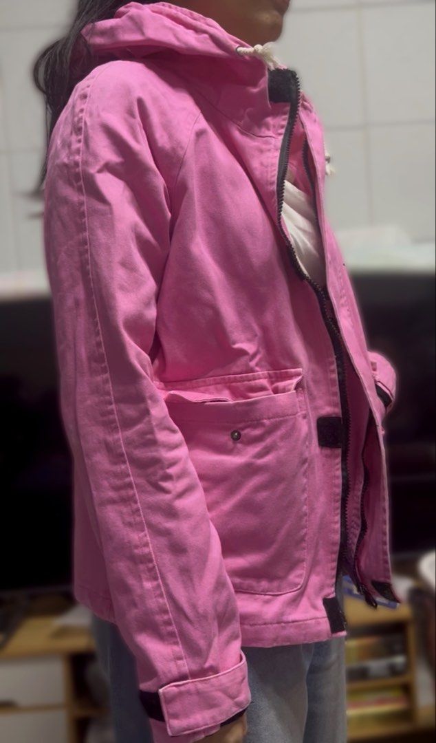 Nike Jordan Hooded Utility Jacket - Pink (Category: Coats, Jackets and Outerwear) located in Surigao. Submitted by boonz71_1971 (Listing ID 1464923937, Image 2). Description: “Declutter Sale - Gently used” - Brand: Jordan - Color: Bright Pink with Black details - Size: Small Width: 18” Length 22” - Design: Black Jumpman logo, big JORDAN lettering, and number 23 on chest and back - Features: Full zip front, adjustable hood drawstrings, multiple po