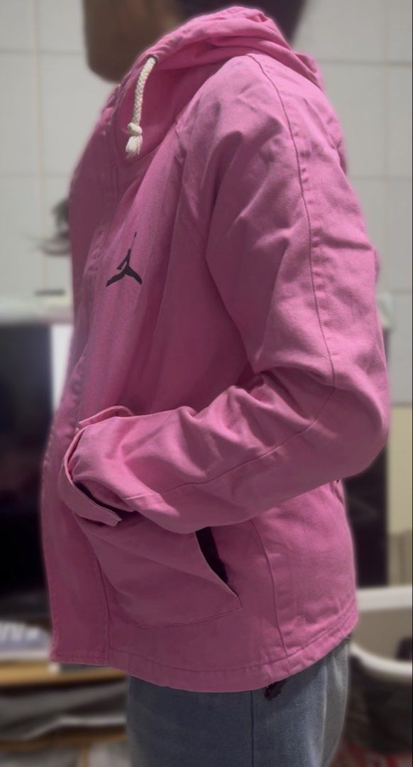 Nike Jordan Hooded Utility Jacket - Pink (Category: Coats, Jackets and Outerwear) located in Surigao. Submitted by boonz71_1971 (Listing ID 1464923937, Image 3). Description: “Declutter Sale - Gently used” - Brand: Jordan - Color: Bright Pink with Black details - Size: Small Width: 18” Length 22” - Design: Black Jumpman logo, big JORDAN lettering, and number 23 on chest and back - Features: Full zip front, adjustable hood drawstrings, multiple po