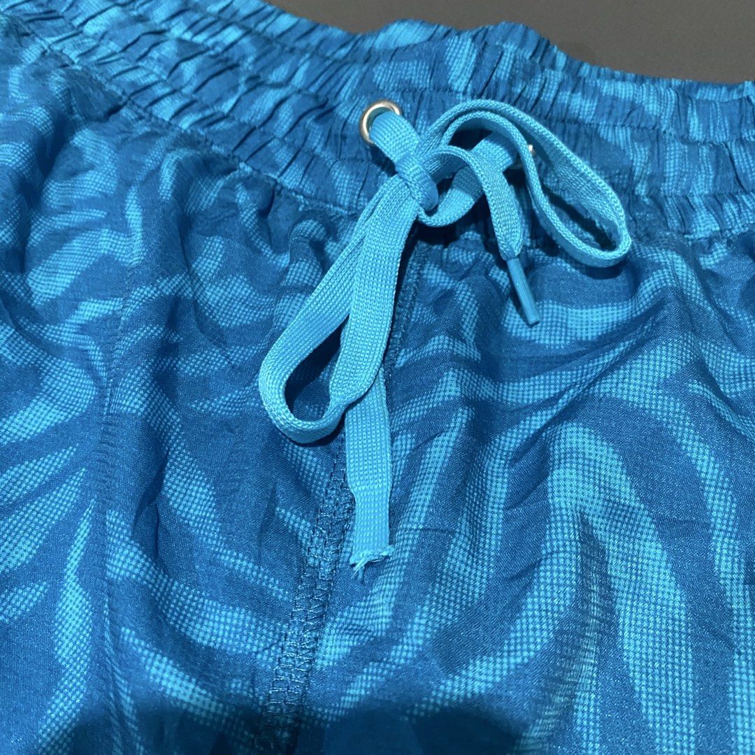 Juicy Couture Blue Zebra Pattern Athletic Shorts (Category: Shorts) located in Villasis. Submitted by thriftngrind (Listing ID 1464912508, Image 3). Description: - Large size - Brand: Juicy Couture - Color: Bright blue with zebra print and light blue contrast trim - Design: Elastic waistband with matching drawstring, metal eyelets, and pink Juicy script logo near the hem - Fit & Material: Lightweight, comfortable fit with curved hems - Condition: