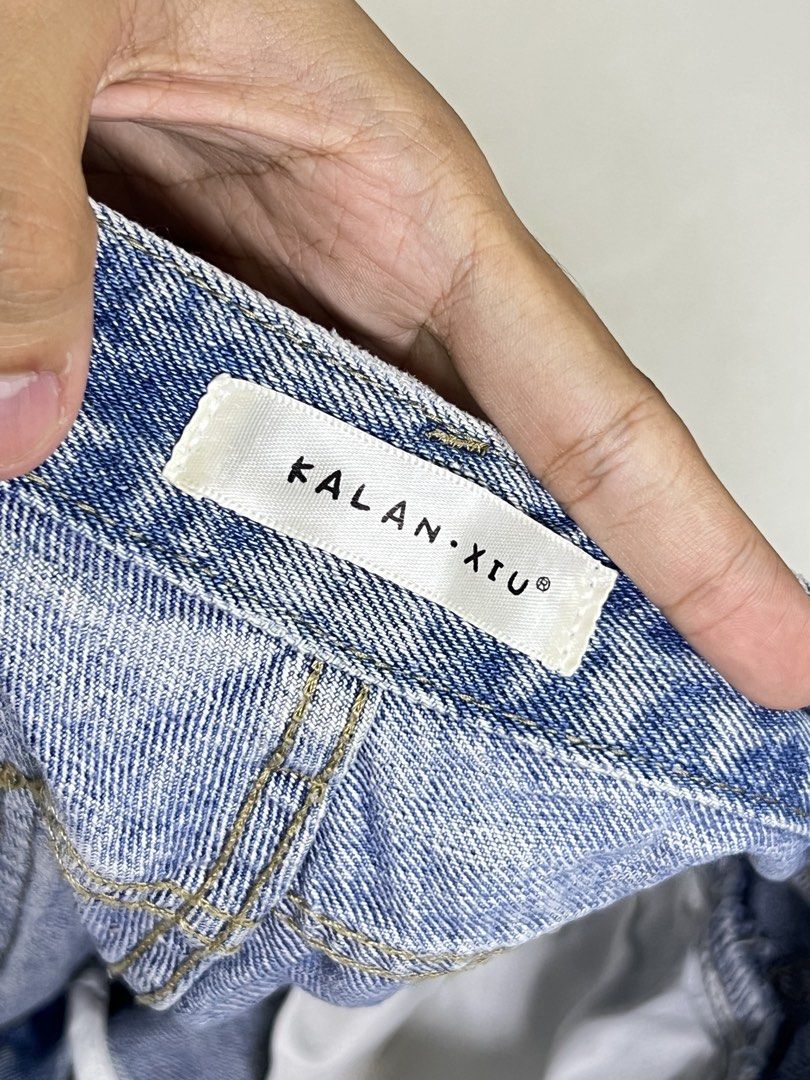 Kalan Xiu Distressed Denim Shorts (Category: Shorts) located in Manila. Submitted by sennisen (Listing ID 1464913169, Image 3). Description: - Brand: Kalan Xiu - Style: High-waisted light wash denim shorts - Details: Heavy distressing, ripped accents near pockets, and frayed raw hem - Design: Classic 5-pocket layout with contrast stitching and secure button/zipper fly - Condition: Brand new / Excellent (Ready to ship!) - Perfect for: Casual summe