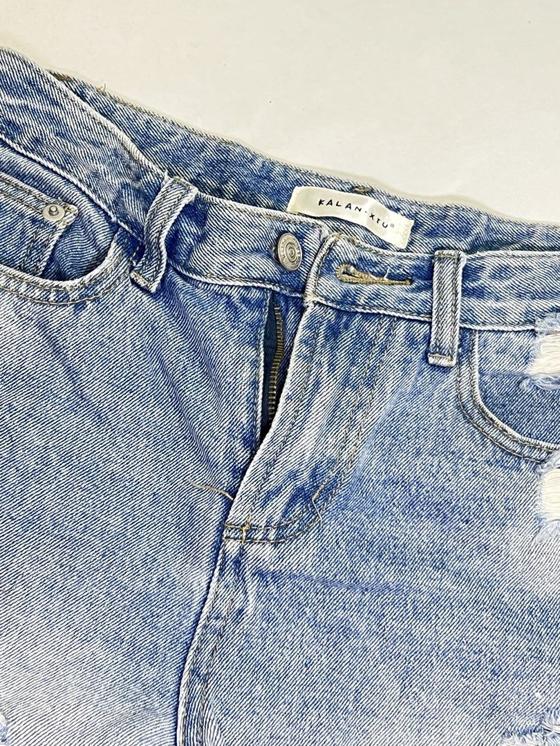 Kalan Xiu Distressed Denim Shorts (Category: Shorts) located in Manila. Submitted by sennisen (Listing ID 1464913169, Image 2). Description: - Brand: Kalan Xiu - Style: High-waisted light wash denim shorts - Details: Heavy distressing, ripped accents near pockets, and frayed raw hem - Design: Classic 5-pocket layout with contrast stitching and secure button/zipper fly - Condition: Brand new / Excellent (Ready to ship!) - Perfect for: Casual summe