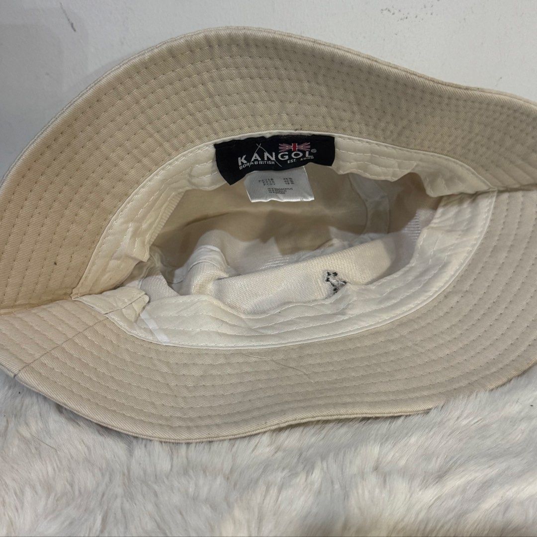 Kangol Beige Bucket Hat (Category: Hats & Beanies) located in Rizal. Submitted by houseofbell (Listing ID 1464941784, Image 3). Description: - Brand: Kangol - Color: Classic Neutral Beige - Design: Features embroidered kangaroo logo on the front Still excellent condition No flaws .