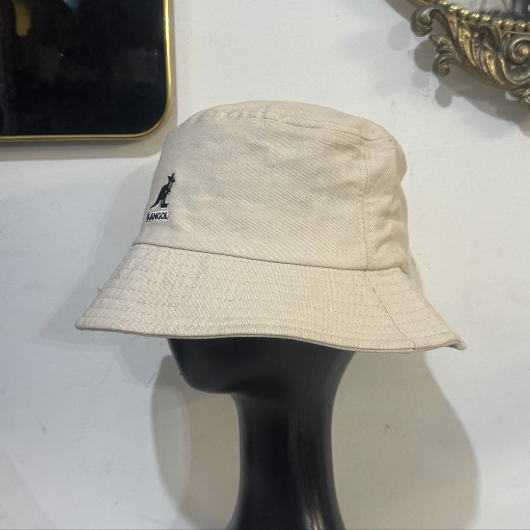 Kangol Beige Bucket Hat (Category: Hats & Beanies) located in Rizal. Submitted by houseofbell (Listing ID 1464941784, Image 2). Description: - Brand: Kangol - Color: Classic Neutral Beige - Design: Features embroidered kangaroo logo on the front Still excellent condition No flaws .