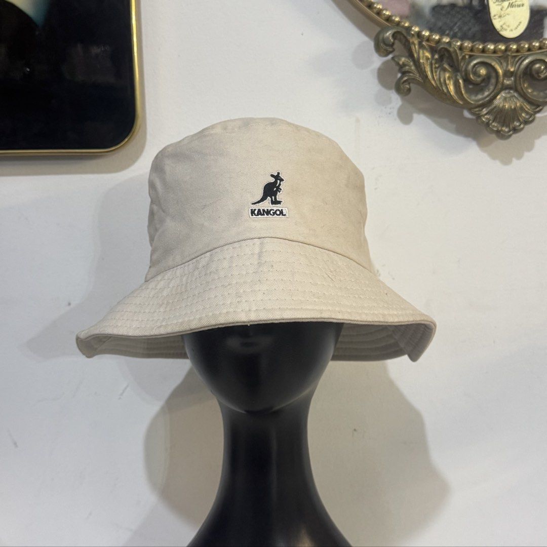 Kangol Beige Bucket Hat (Category: Hats & Beanies) located in Rizal. Submitted by houseofbell (Listing ID 1464941784, Image 1). Description: - Brand: Kangol - Color: Classic Neutral Beige - Design: Features embroidered kangaroo logo on the front Still excellent condition No flaws .