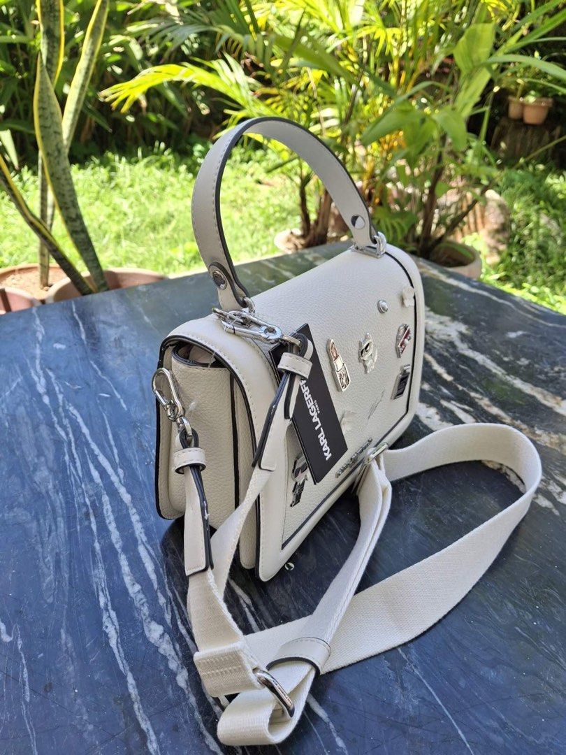 Karl Lagerfeld (Category: Luxury Bags & Wallets) located in Manila. Submitted by bubuamponin (Listing ID 1464827040, Image 2). Description: - Brand: Karl Lagerfeld - Color: Clean white with silver-tone hardware - Material: Textured leather-look finish - Condition: Excellent, well-maintained - Original price $248 (price tag included).