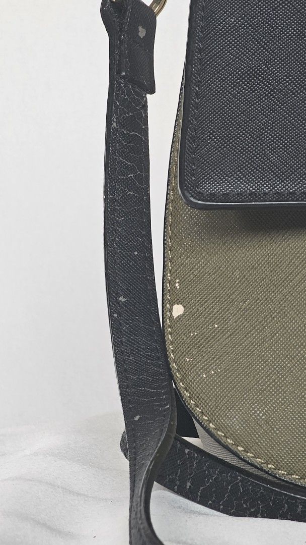 Kate Spade Colorblock Crossbody Bag (Category: Cross-body Bags) located in Quezon. Submitted by cgmhe (Listing ID 1464823247, Image 2). Description: - Brand: Kate Spade - Style: Crossbody bag with adjustable black strap - Design: Chic colorblock in black, olive green, and cream - Material: Saffiano textured leather with gold-tone hardware and front logo lettering - Condition: Pre-loved with flaws (cracking along strap edges, paint peeling spots o